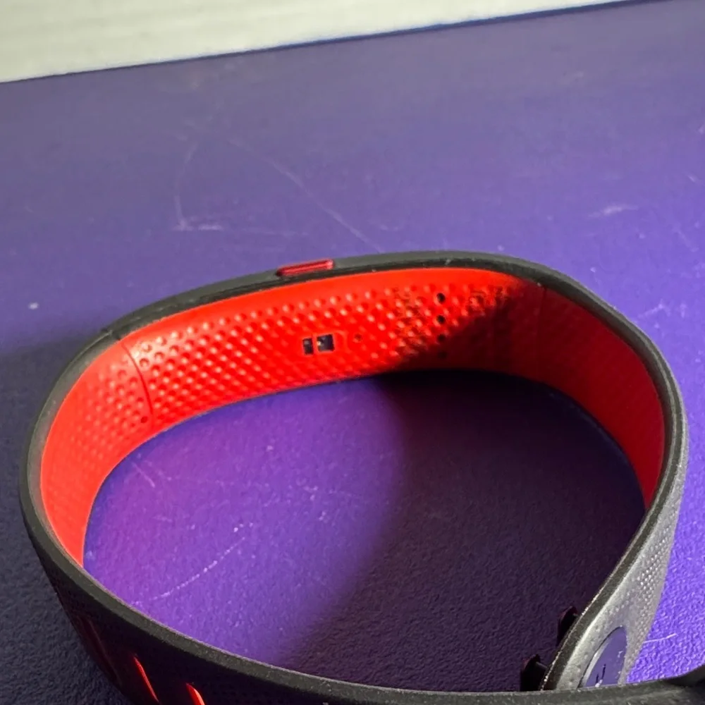 Under Armour htc Activity Tracker wrist band. Black and red, untested.
